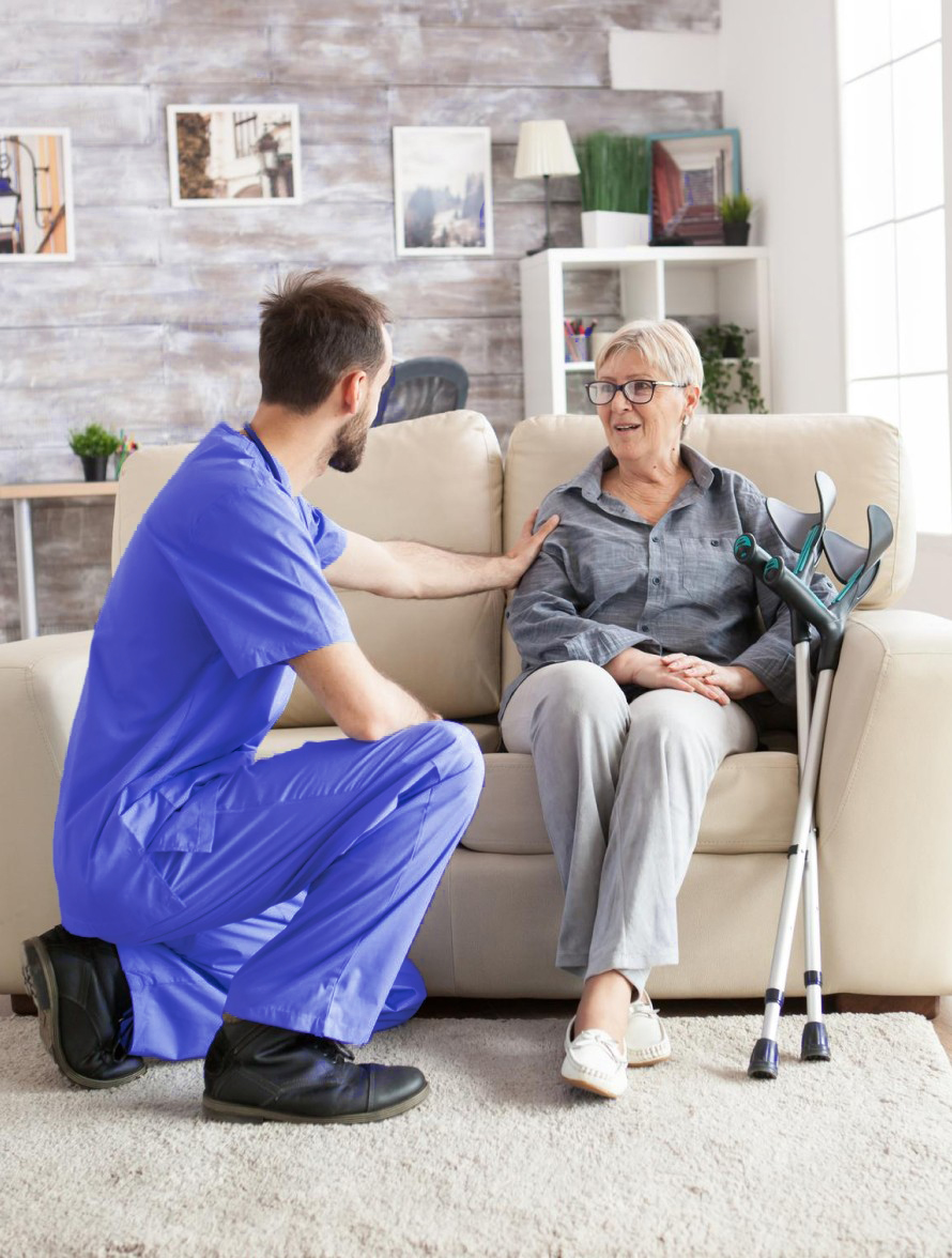 a nurse comforting an elderly person