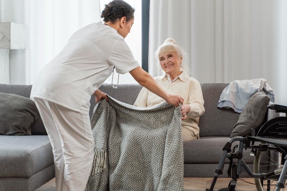 nurse taking care of elderly woman