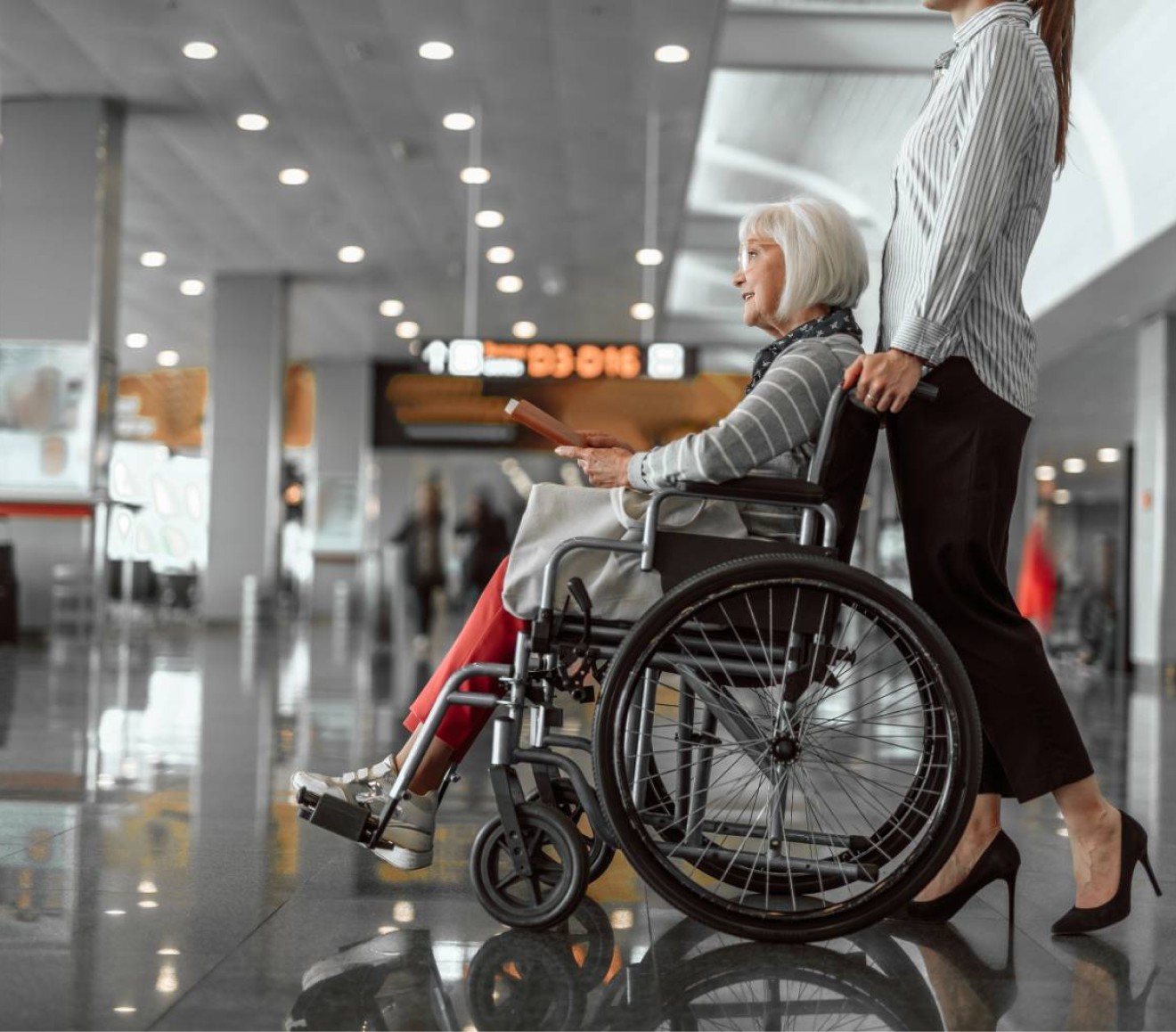 Caregiver escorting a client to a medical appointment