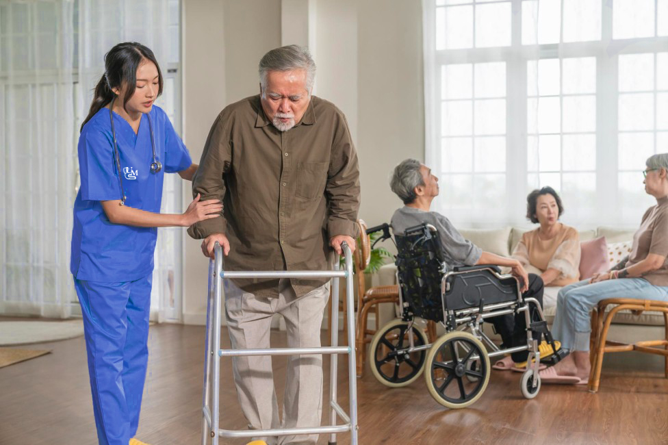 nurse taking care of elderly man