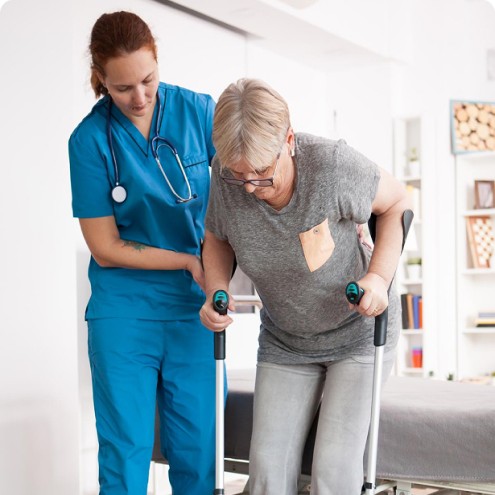 UMS caregiver assisting a client with post-surgery recovery at home